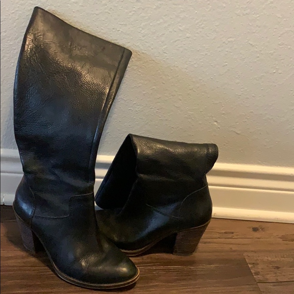 Below the knee heeled black leather boots